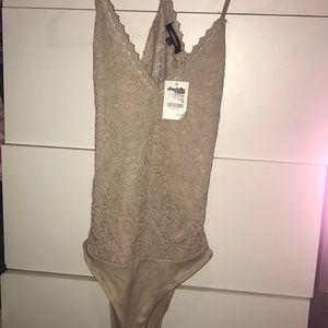Tan body suit size Med brand new